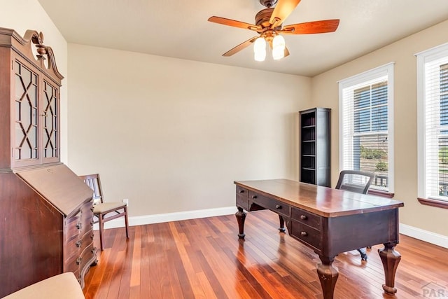 611 Rock Ridge Loop, Canon City, CO 81212 - office featuring baseboards, wood-type flooring, a ceiling fan, and plenty of natural light
