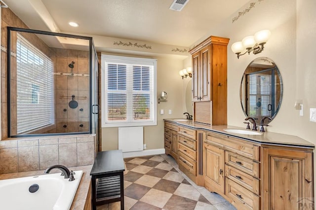 611 Rock Ridge Loop, Canon City, CO 81212 - bathroom with a shower stall, a garden tub, baseboards, double vanity, and recessed lighting