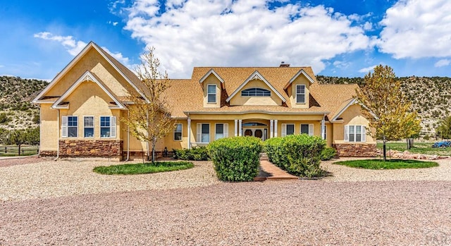 611 Rock Ridge Loop, Canon City, CO 81212 - view of front of property featuring stucco siding, stone siding, and a chimney