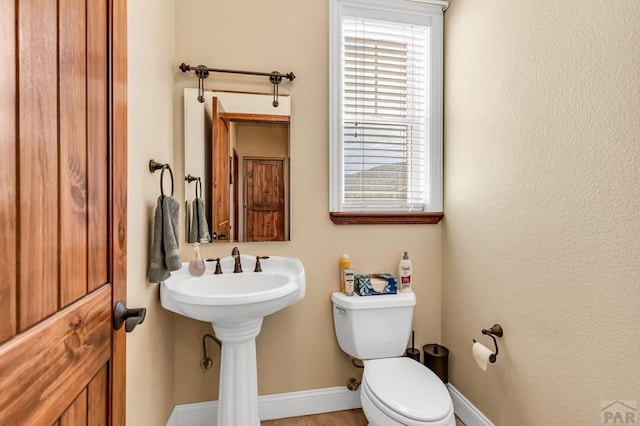 611 Rock Ridge Loop, Canon City, CO 81212 - bathroom featuring plenty of natural light, toilet, and baseboards