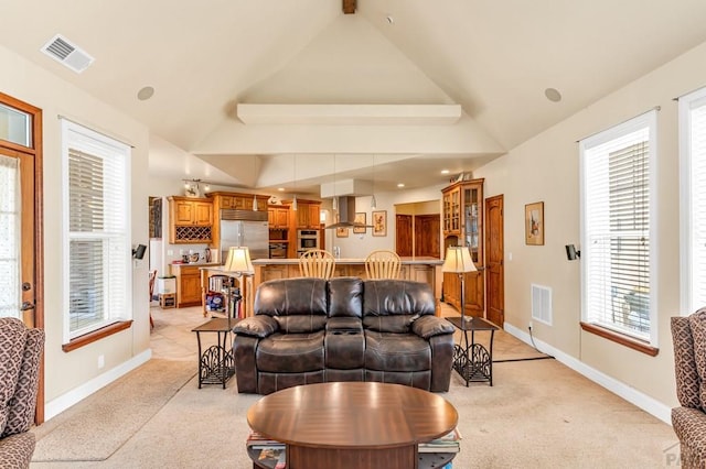 611 Rock Ridge Loop, Canon City, CO 81212 - living area featuring light carpet, vaulted ceiling, and baseboards