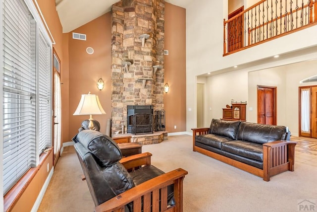 611 Rock Ridge Loop, Canon City, CO 81212 - living room with high vaulted ceiling, carpet, baseboards, and a fireplace