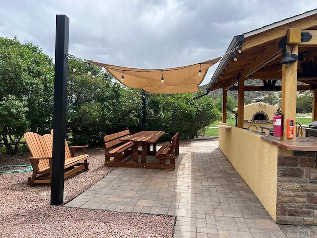 611 Rock Ridge Loop, Canon City, CO 81212 - view of patio featuring an outdoor kitchen, outdoor dining space, and a gazebo