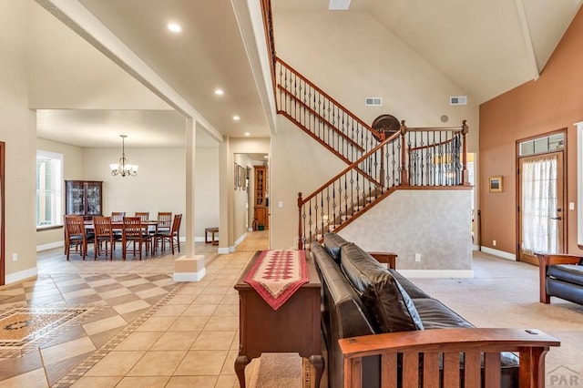 611 Rock Ridge Loop, Canon City, CO 81212 - living area featuring stairs, baseboards, a chandelier, high vaulted ceiling, and recessed lighting