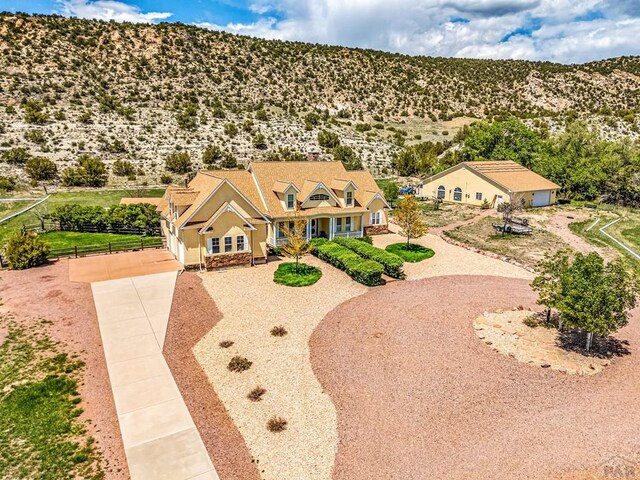 611 Rock Ridge Loop, Canon City, CO 81212 - view of front of home with dirt driveway and a mountain view