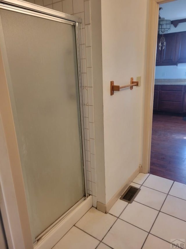 597 Piute Rd, Westcliffe, CO 81252 - full bath with a stall shower, tile patterned flooring, and baseboards