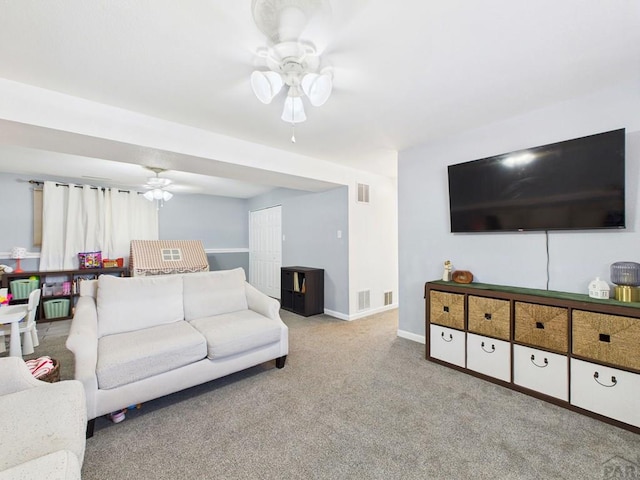 3210 Shalimar Ter, Pueblo, CO 81008 - carpeted living area with ceiling fan and baseboards