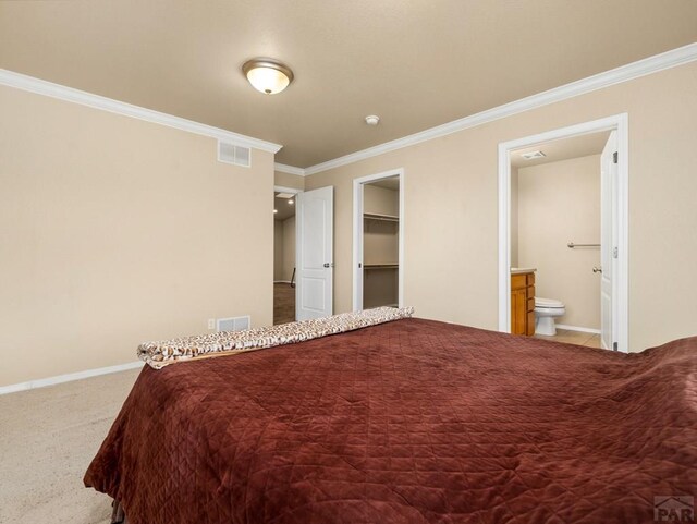 bedroom featuring baseboards, carpet floors, visible vents, and crown molding