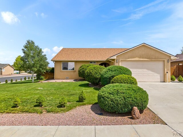 ranch-style house featuring stucco siding, crawl space, a garage, driveway, and a front lawn