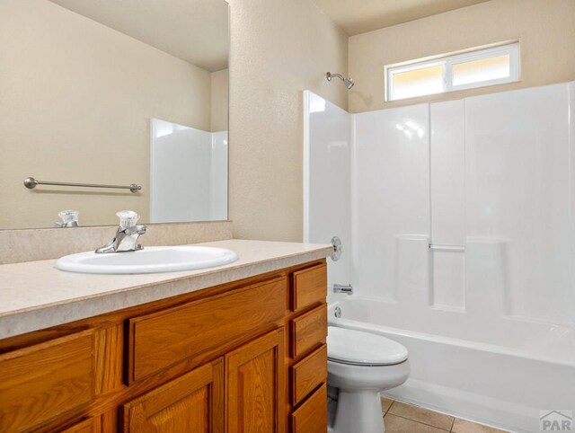 full bath featuring shower / bathtub combination, vanity, tile patterned flooring, and toilet