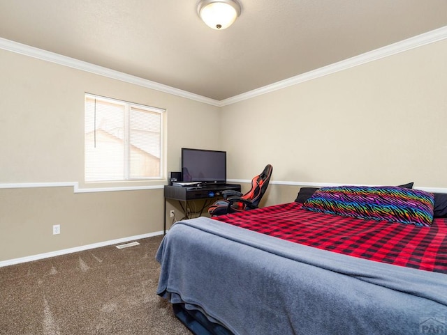 carpeted bedroom featuring baseboards, visible vents, and crown molding