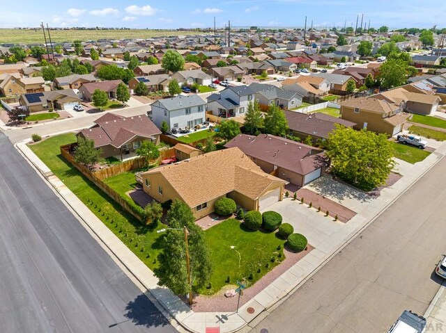 birds eye view of property with a residential view