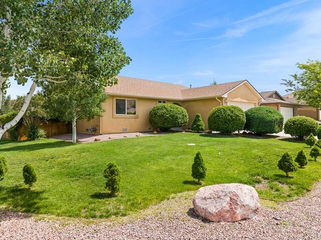 single story home featuring crawl space, a garage, fence, and a front lawn