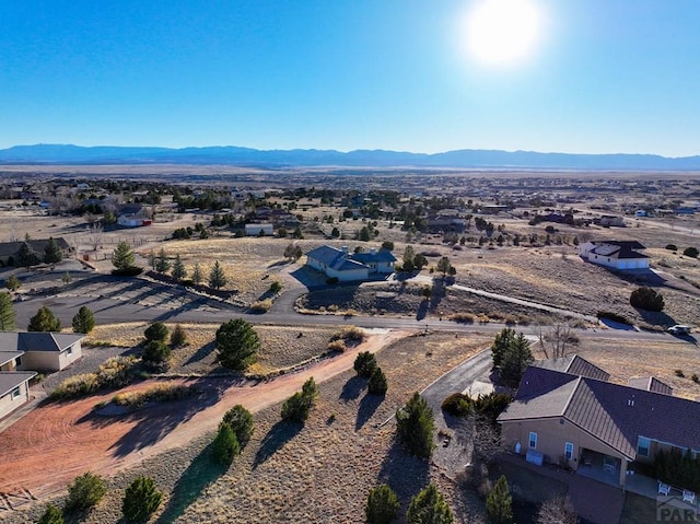 drone / aerial view featuring a mountain view