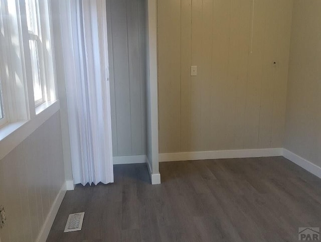 1025 W 17th St, Pueblo, CO 81003 - unfurnished bedroom with dark wood finished floors and baseboards