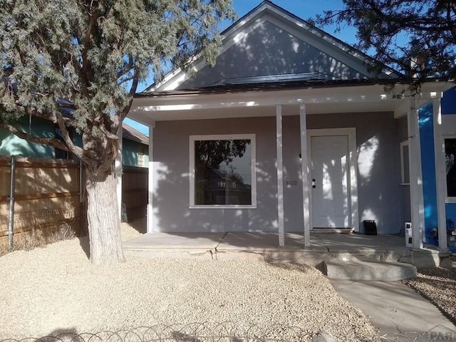 1025 W 17th St, Pueblo, CO 81003 - rear view of house featuring covered porch and stucco siding