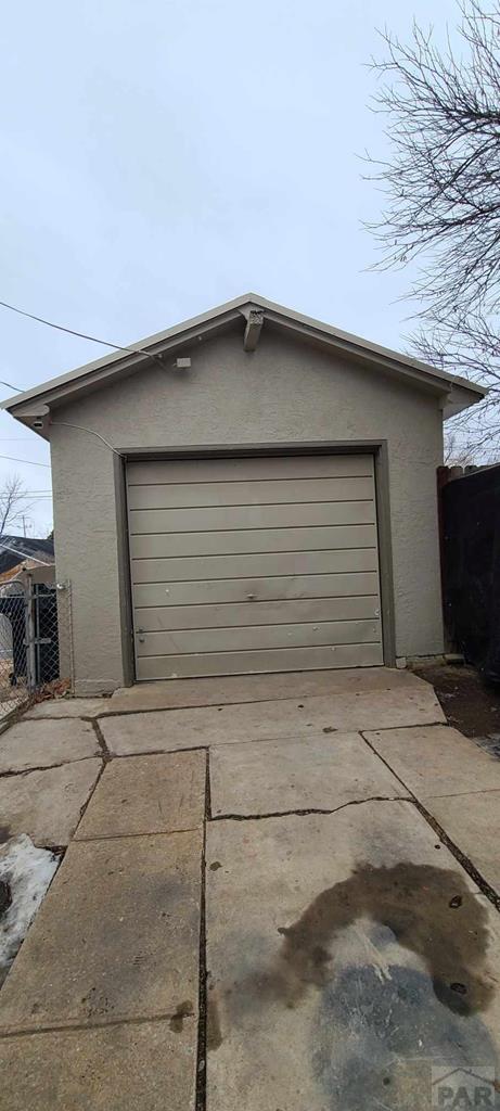 garage featuring fence