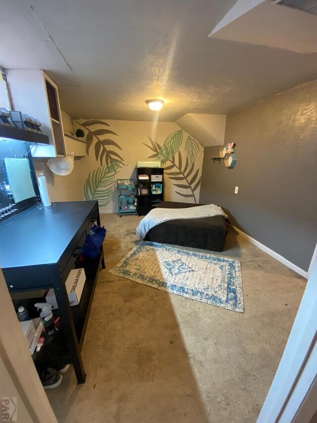 bedroom with lofted ceiling