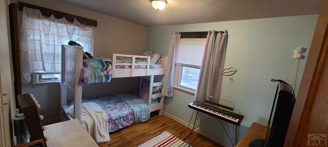 bedroom with wood finished floors