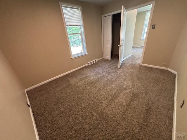 1610 E 6th St, Pueblo, CO 81001 - unfurnished bedroom featuring baseboards, carpet floors, and a closet
