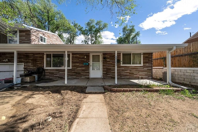 2101 Salt Dr, Colorado Springs, CO 80910 - view of front facade with a porch