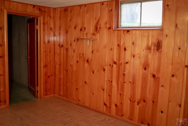 empty room with wooden walls