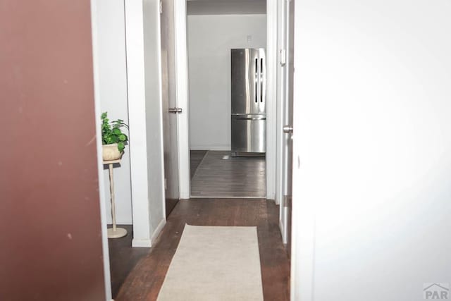 corridor with dark wood-style floors