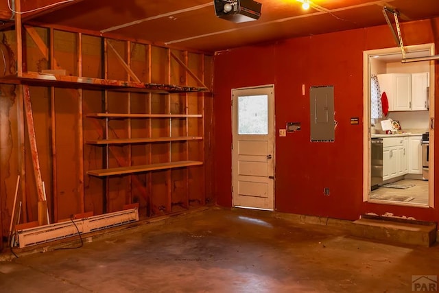 garage with a garage door opener and electric panel