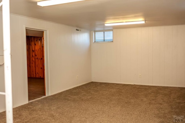 below grade area featuring carpet floors and visible vents