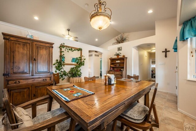 dining area with arched walkways, ceiling fan, lofted ceiling, recessed lighting, and baseboards