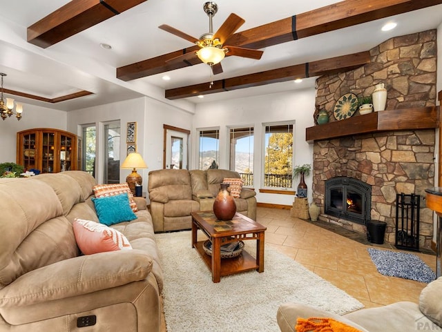 8760 Ridge Rd, Beulah, CO 81023 - living area featuring a stone fireplace, beam ceiling, tile patterned floors, ceiling fan with notable chandelier, and recessed lighting