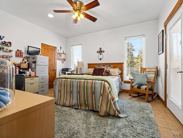 8760 Ridge Rd, Beulah, CO 81023 - bedroom with light tile patterned floors, multiple windows, and a ceiling fan