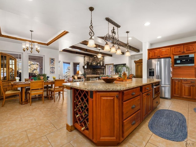 8760 Ridge Rd, Beulah, CO 81023 - kitchen featuring stainless steel fridge, light tile patterned floors, and a center island