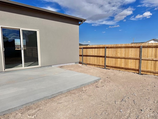 exterior space with a patio area and fence