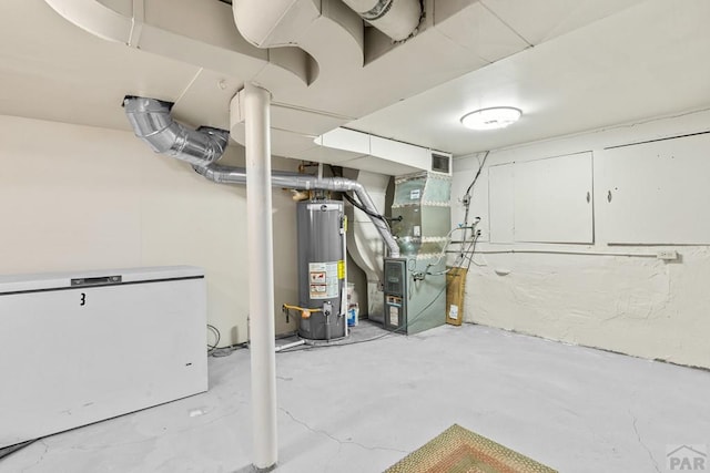 2701 Franklin Ave, Pueblo, CO 81003 - finished basement featuring heating unit, gas water heater, fridge, and visible vents