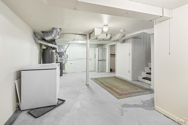 2701 Franklin Ave, Pueblo, CO 81003 - finished basement with water heater, stairway, and white refrigerator
