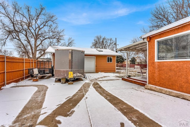 exterior space featuring fence and an outdoor structure