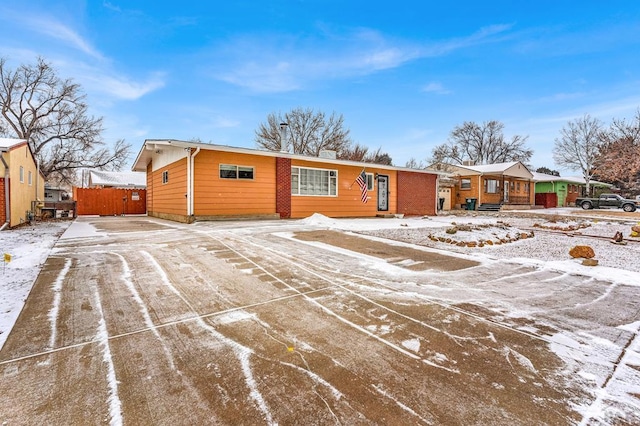 single story home with fence