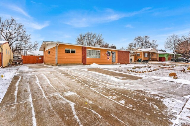 single story home with fence