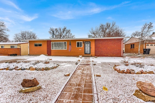 ranch-style house with brick siding