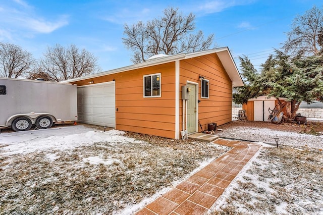 view of snow covered garage