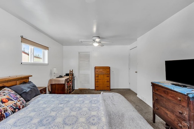 bedroom featuring ceiling fan and dark colored carpet