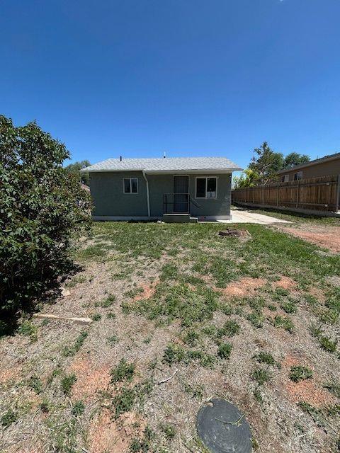 1824 Moore Ave, Pueblo, CO 81005 - rear view of house featuring fence