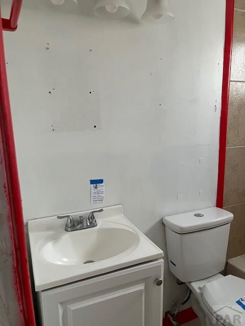 bathroom with toilet and vanity