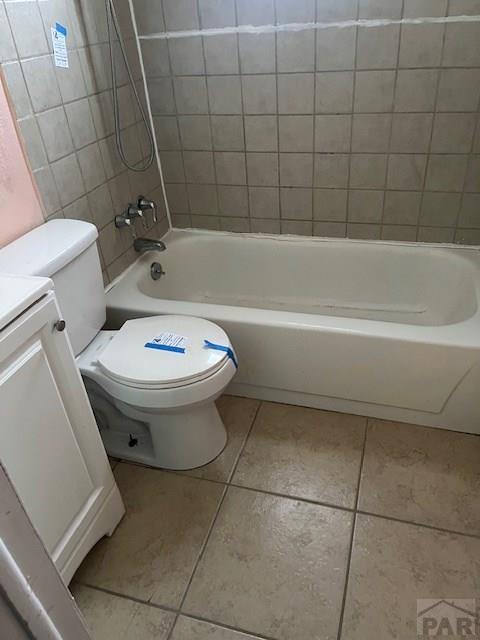 bathroom featuring tile patterned floors, toilet, and vanity