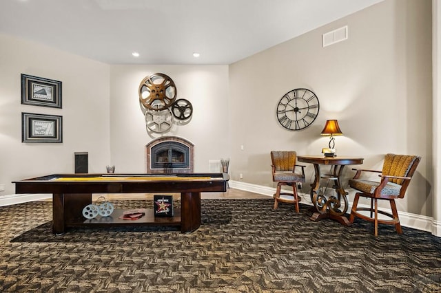 playroom featuring baseboards, visible vents, a fireplace, dark carpet, and recessed lighting