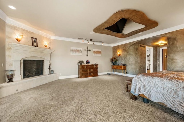 bedroom featuring a fireplace, carpet flooring, visible vents, baseboards, and ornamental molding