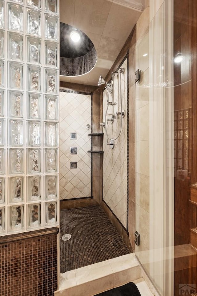 full bathroom with tiled shower