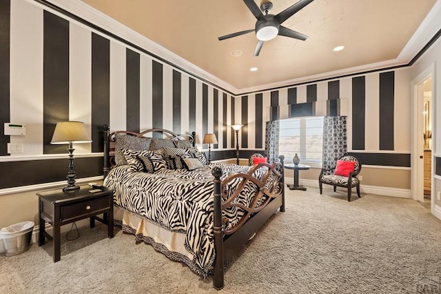 bedroom featuring ceiling fan, baseboards, ornamental molding, carpet, and wallpapered walls