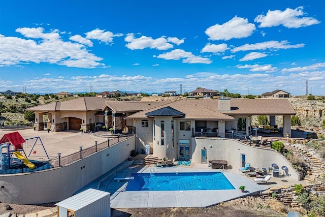 view of swimming pool with a fenced in pool, a patio area, and fence